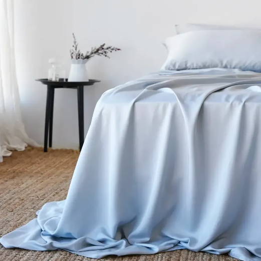 Groundd  Bamboo Sheets in light grey on bed