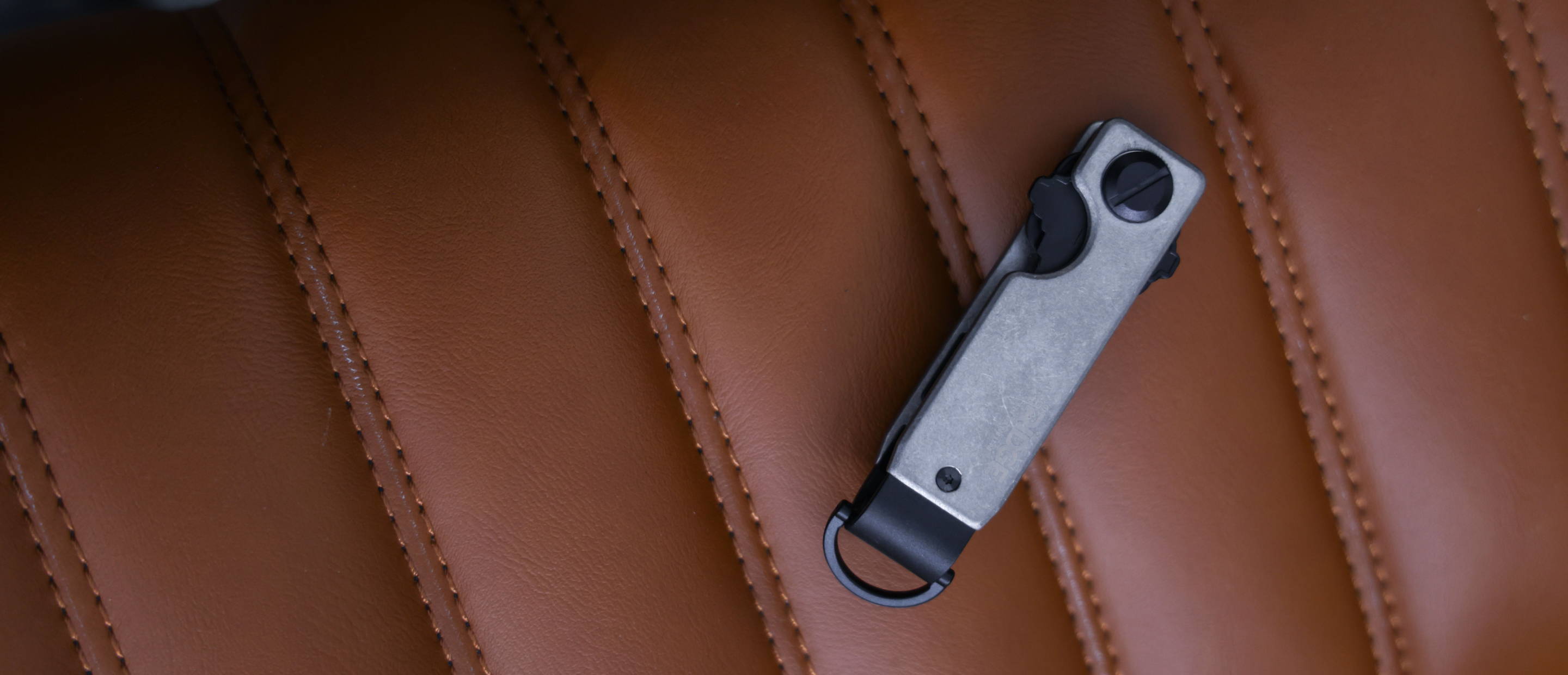 Stonewashed Titanium keycase with leather background