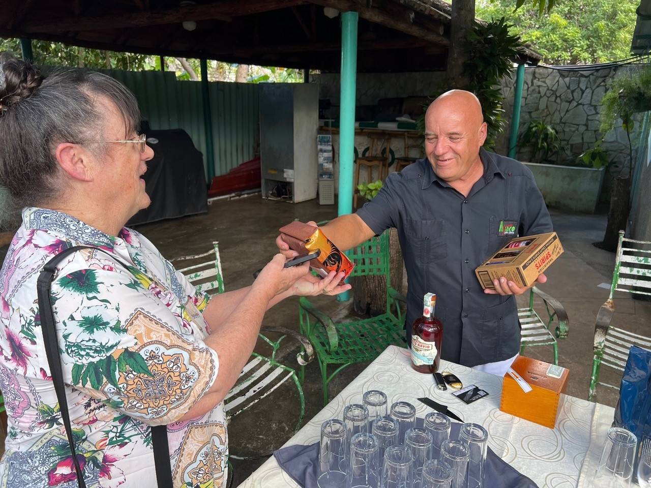 Photographs show Susan Savage of the Mendocino Coast Community Healthcare District delivering End the Embargo Coffee to one of her friends in Cuba in late January 2023 