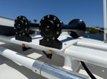 Close-up of dual black marine air horns mounted on white hardtop frame of Lewis' Fountain Express Cruiser photo 1