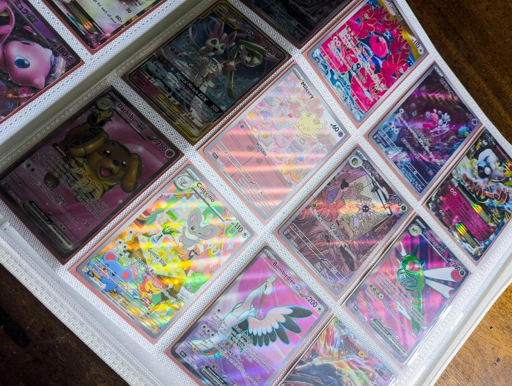 A collection of colorful trading cards displayed in a binder.