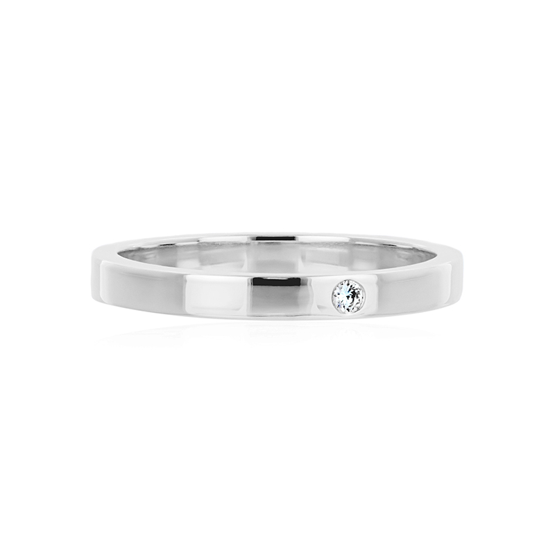 Thin stackable ring with a single diamond inlayed