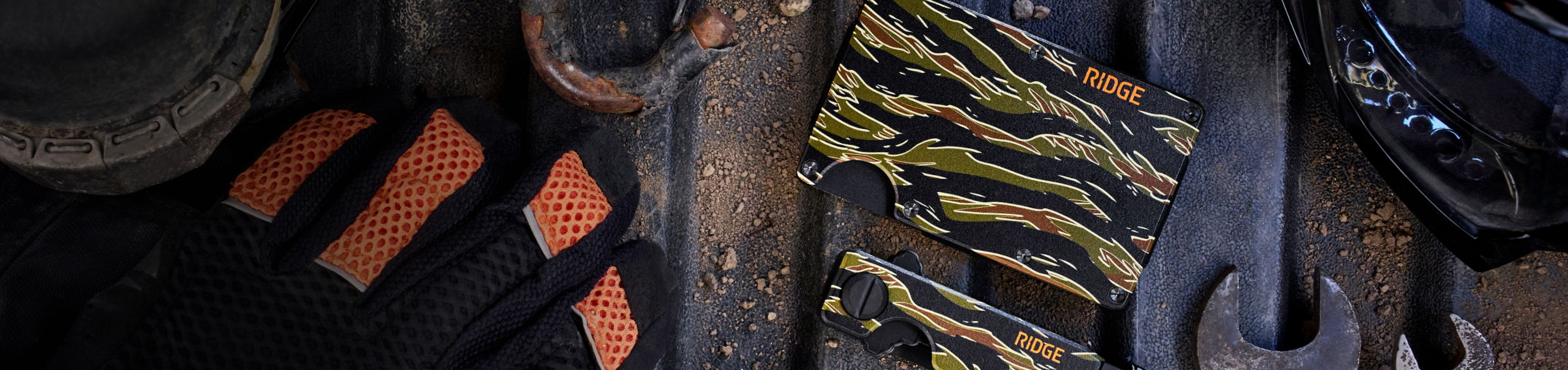 Tools and gloves arranged on a work surface.