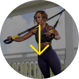 Person exercising with resistance bands outdoors.