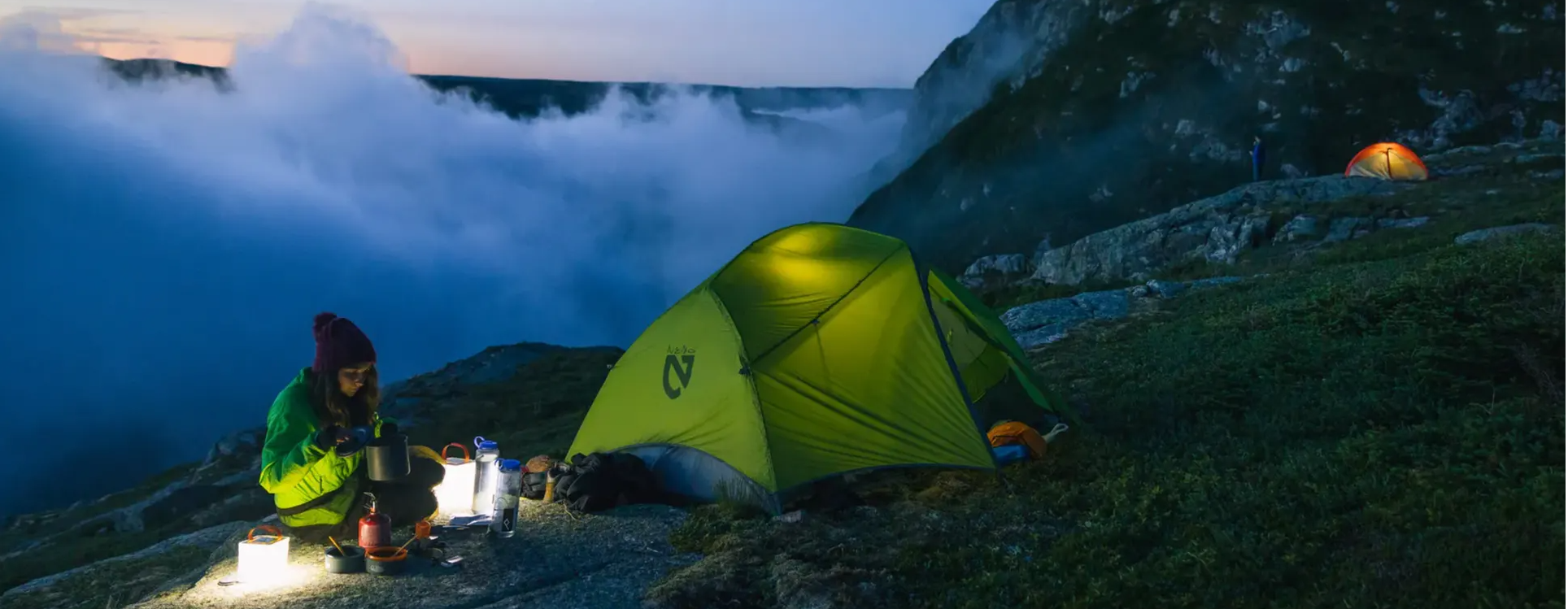 Lanterns light up mountain camp sites.