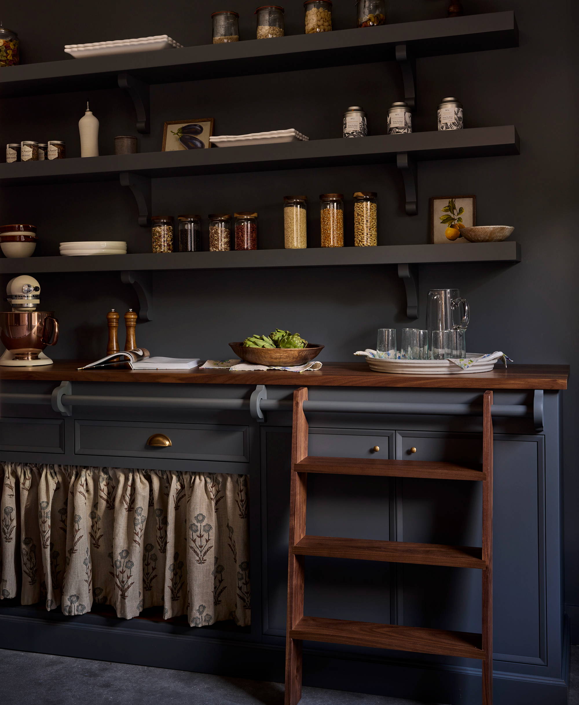 Dark navy kitchen and pantry design by Unique Kitchens & Bath, with dark cabinetry and open shelves 