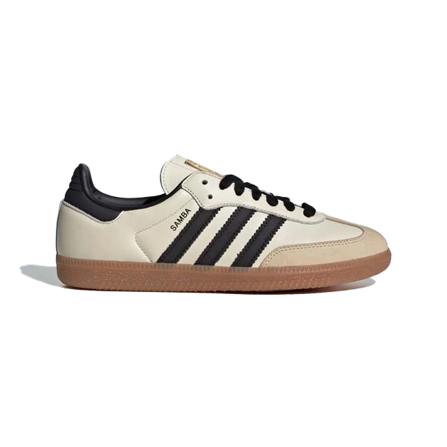 A side view of a cream-colored sneaker with black stripes.