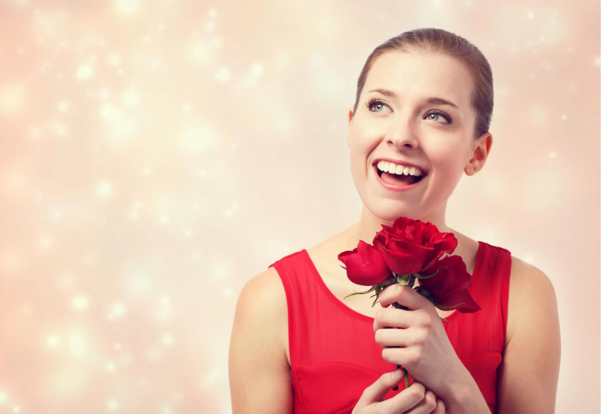 woman holding roses smiling