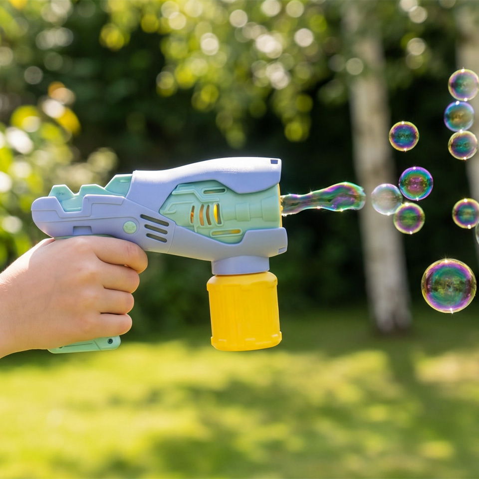 A bubble gun shooting bubbles in a green outdoor setting.