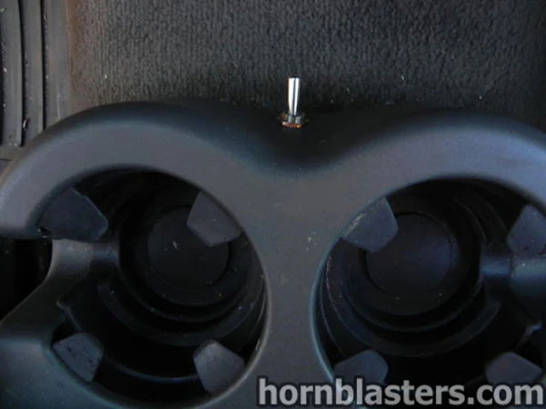 Close-up of the custom horn control mounted in the cup holder area of Thomas's 2005 Silverado, install photo 10
