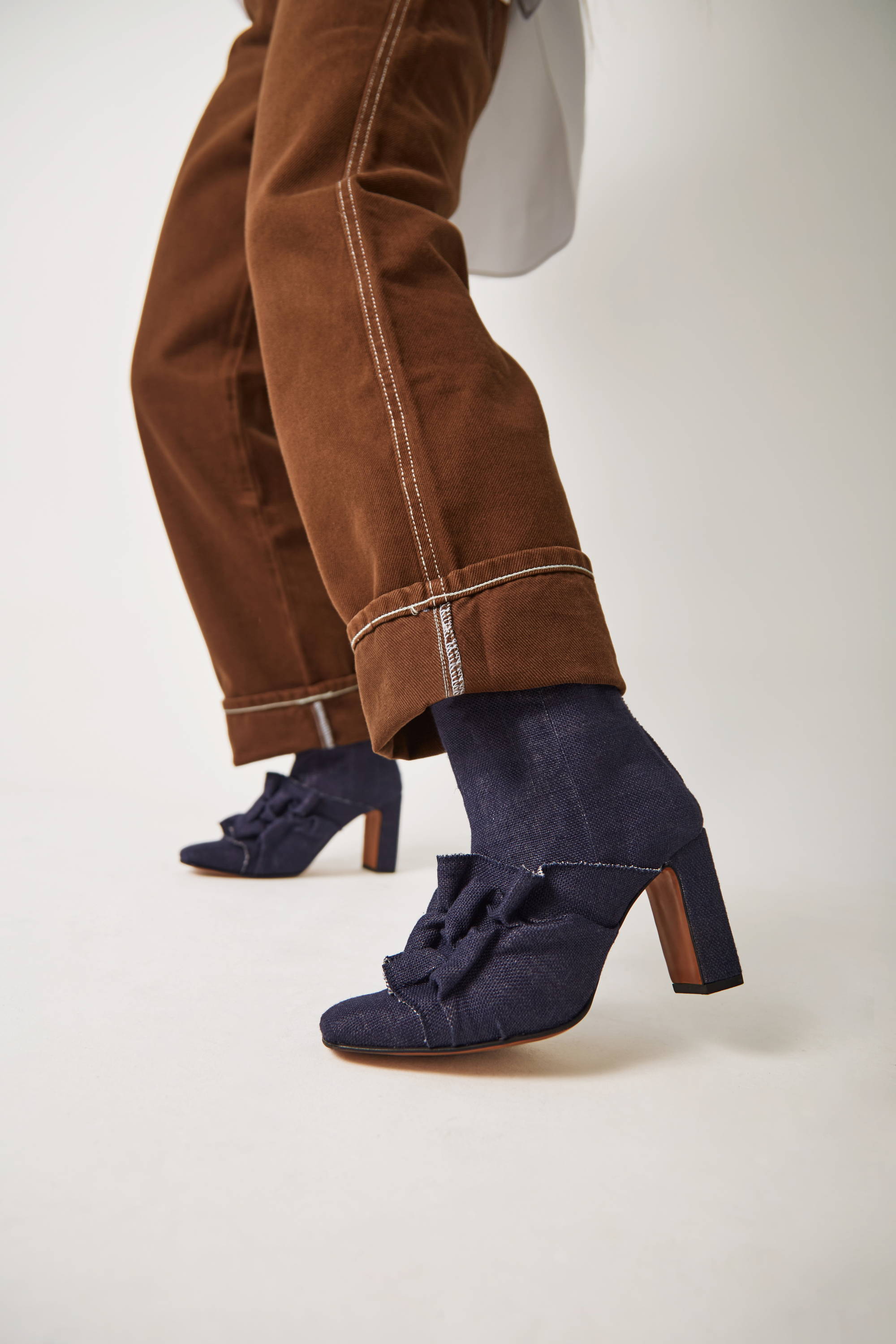 Vandrelaar Greta navy linen high-heel boots styled with brown denim jeans