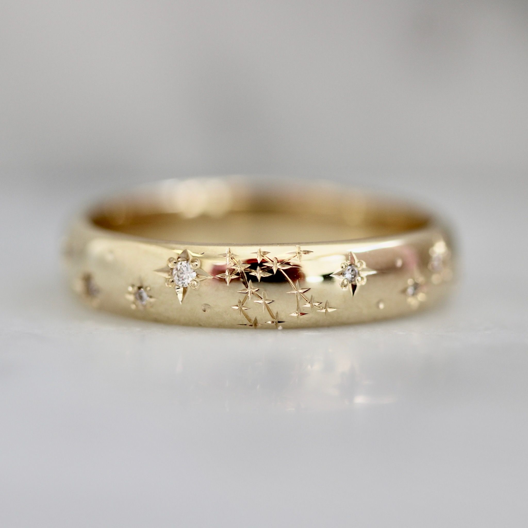 Hand-engraved wedding band with zodiac constellations