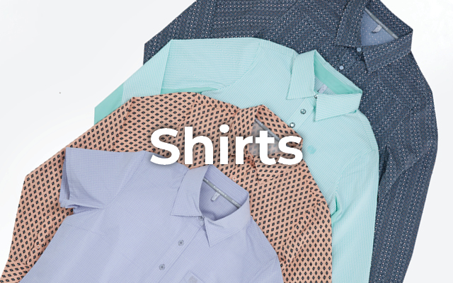Shirts in various colors and patterns laid out on a flat surface.