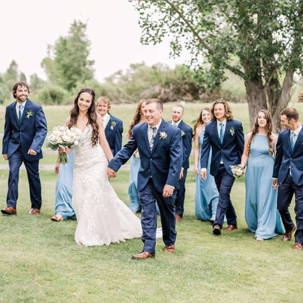 Large wedding party wearing serene blue