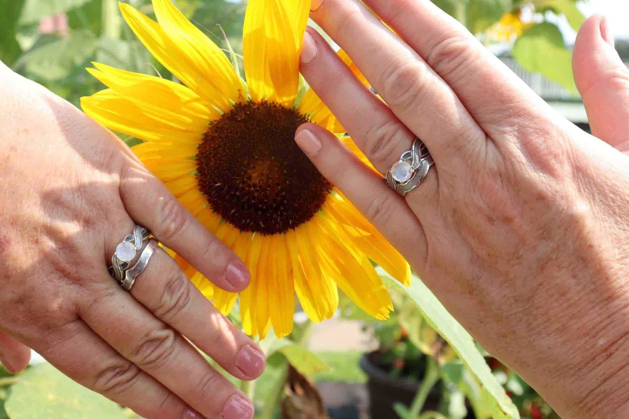 Couple wearing matching diamond and meteorite engagement rings