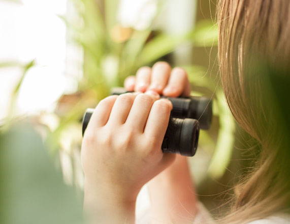 Child using binoculars