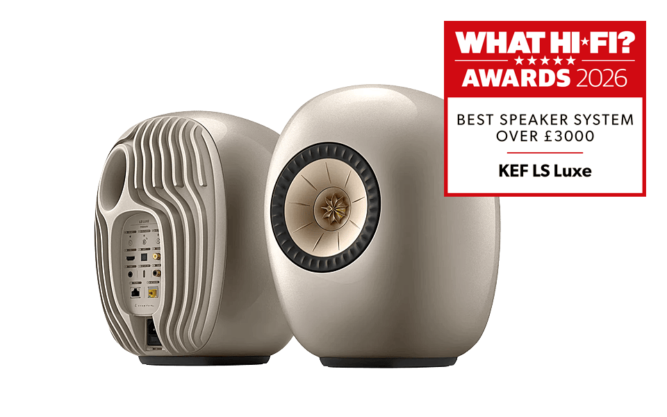 A pair of KEF LS Luxe speakers with an award badge.