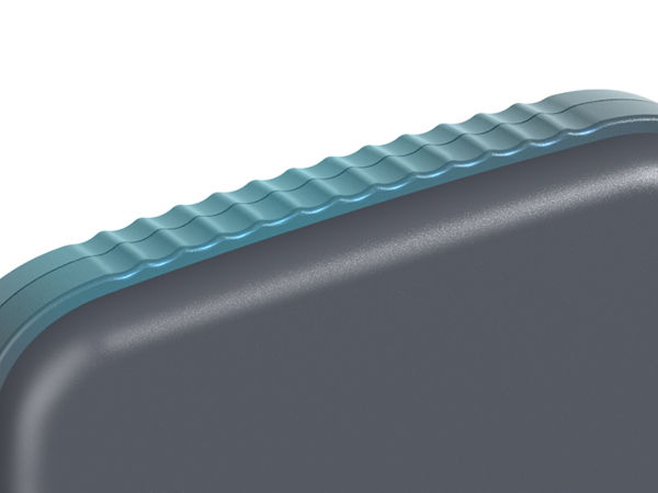 Close-up of a gray container with a textured blue lid.