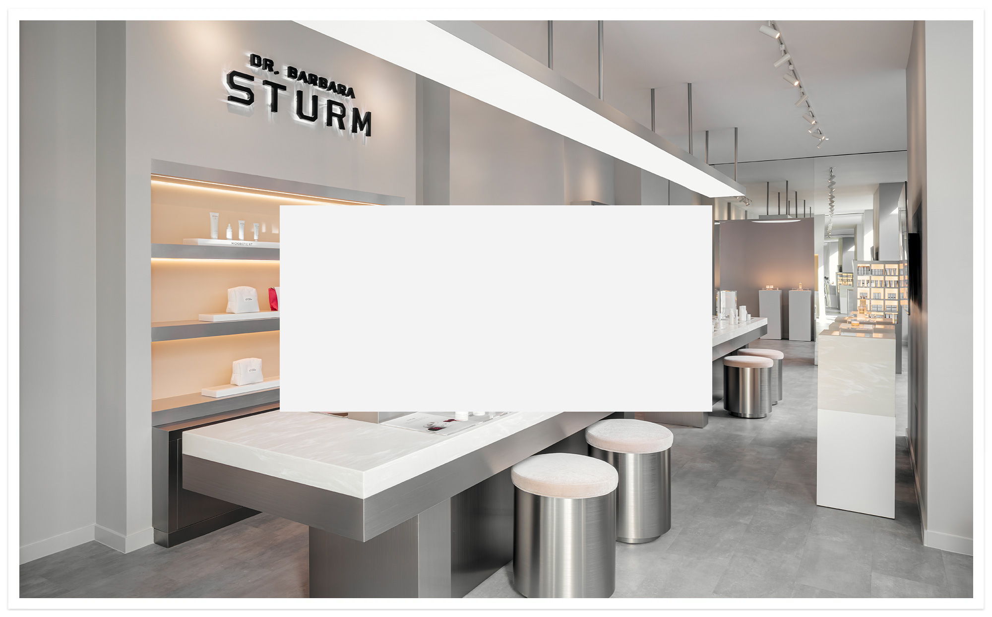 Modern retail space with sleek design and minimalistic furniture.