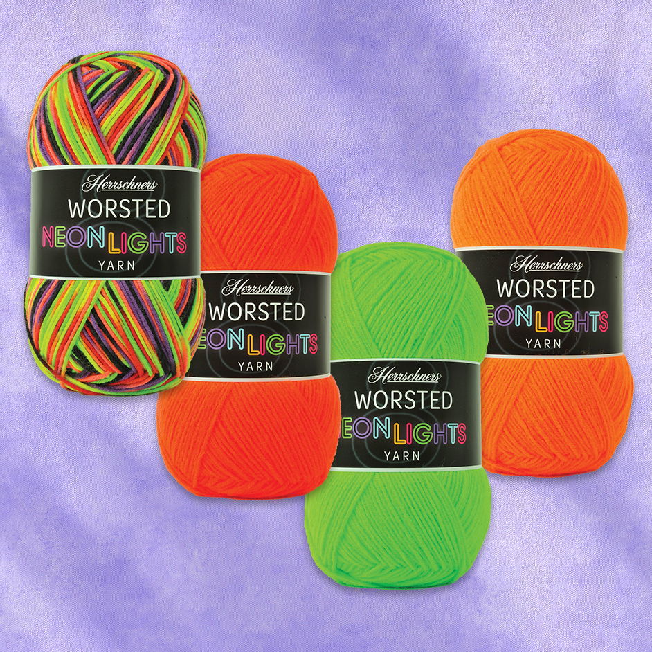 Four skeins of brightly colored Herrschners Worsted Neon Lights