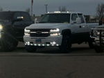 James' white 2001 Chevrolet Silverado 2500HD with lights on thumbnail