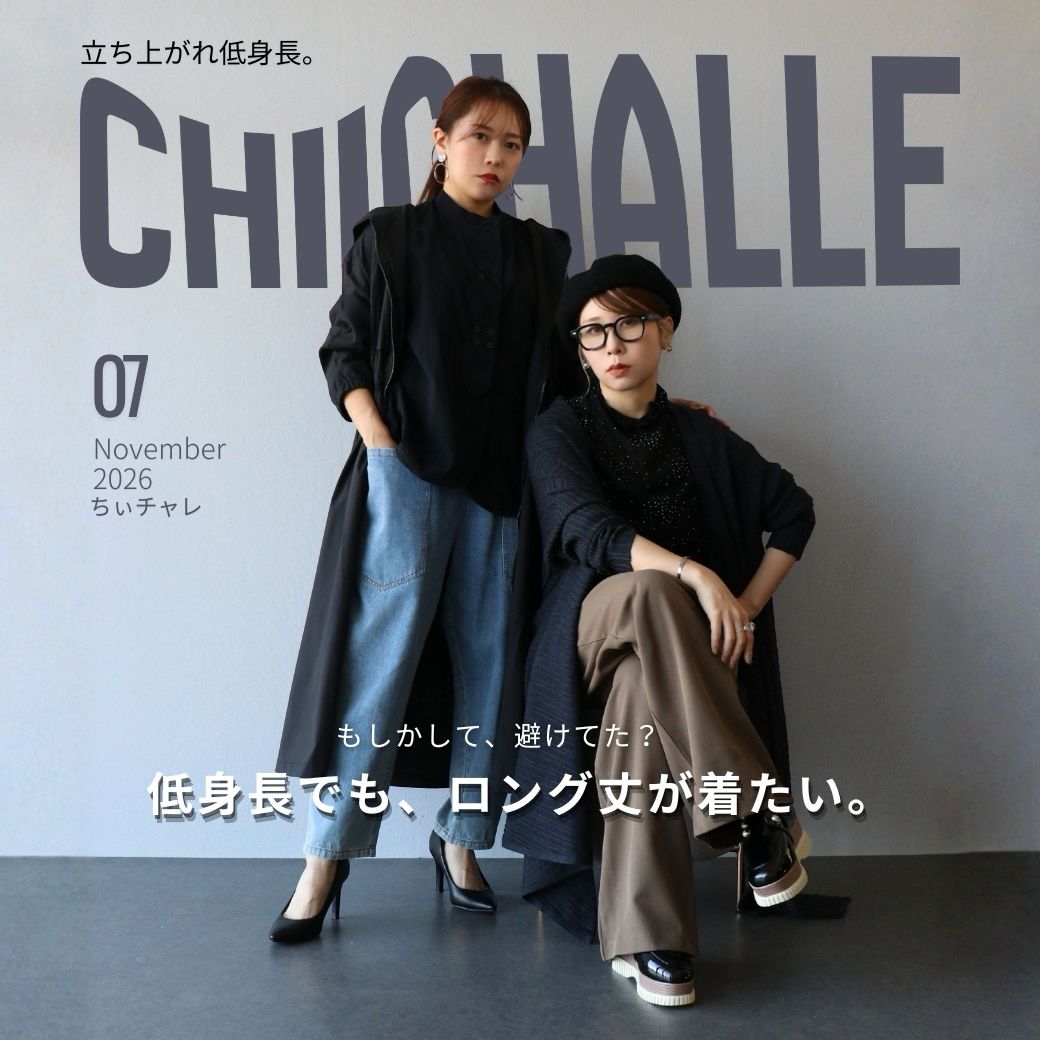 A man and woman posing in stylish outfits against a minimalist background.