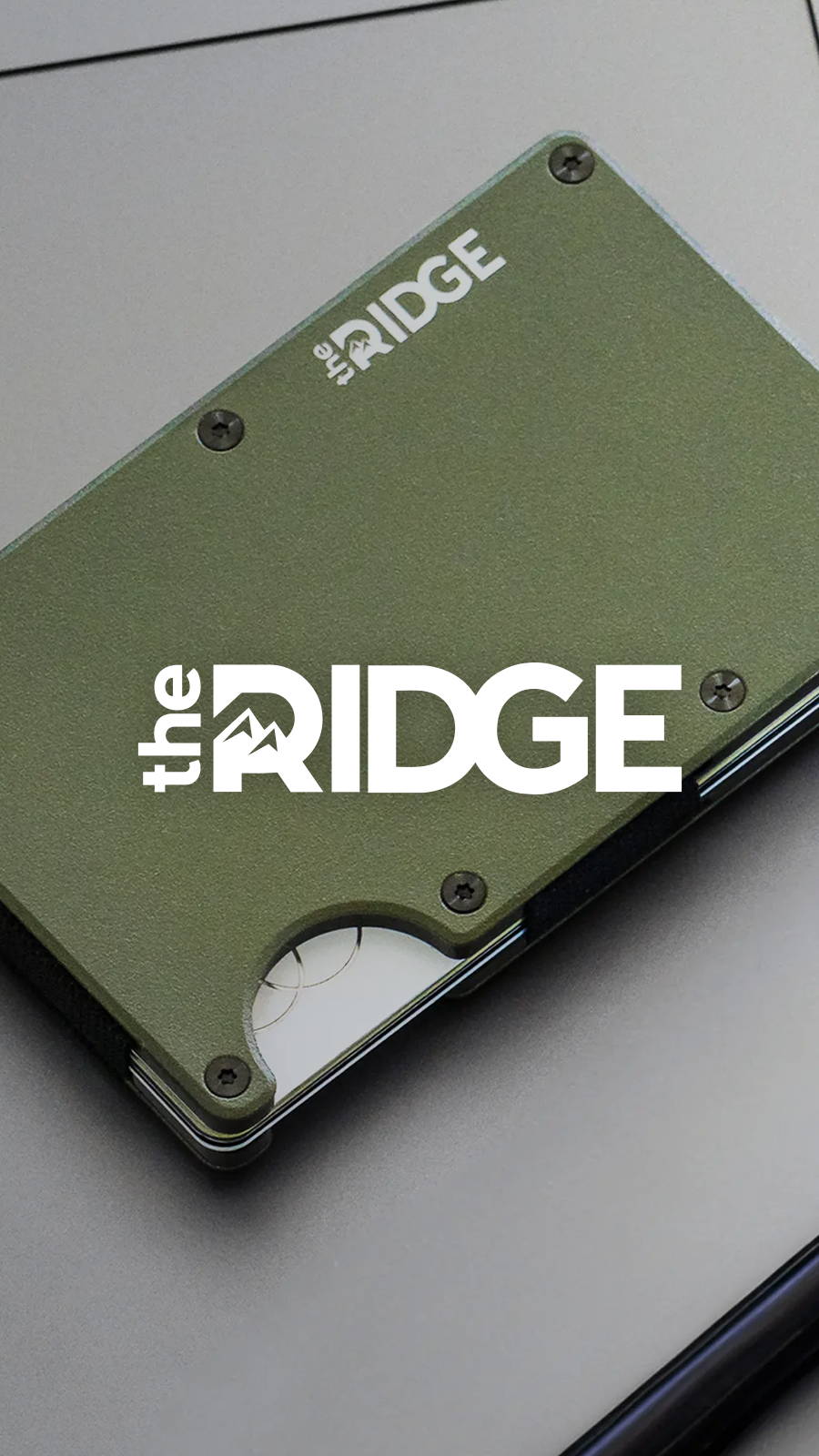 The Ridge Wallet in green laying on metal table