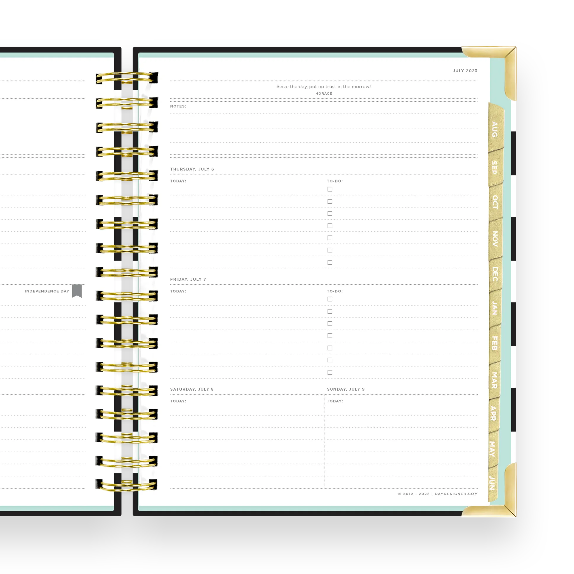 open planner to show weekly page layout with gold tabs, corners and binding