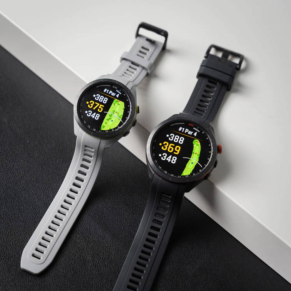 Gray 42 mm Garmin Approach S70  and black 47 mm Approach S70 golf watches side by side