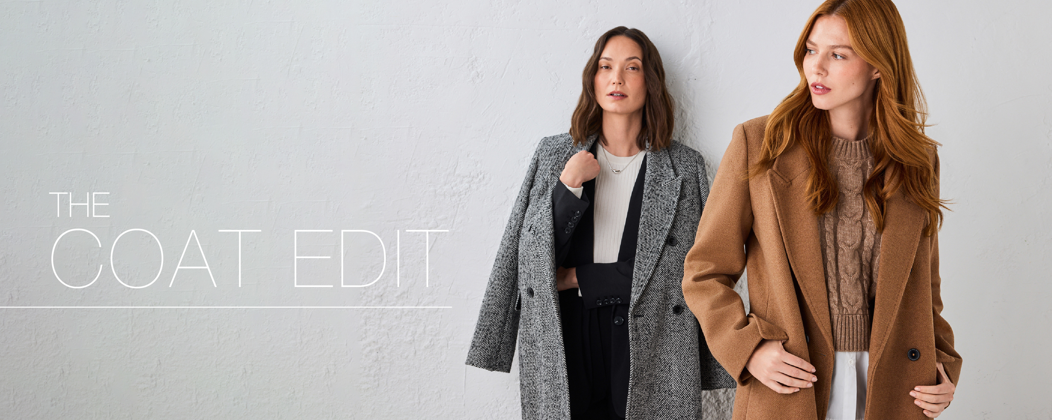 Two women modeling stylish coats against a neutral background.