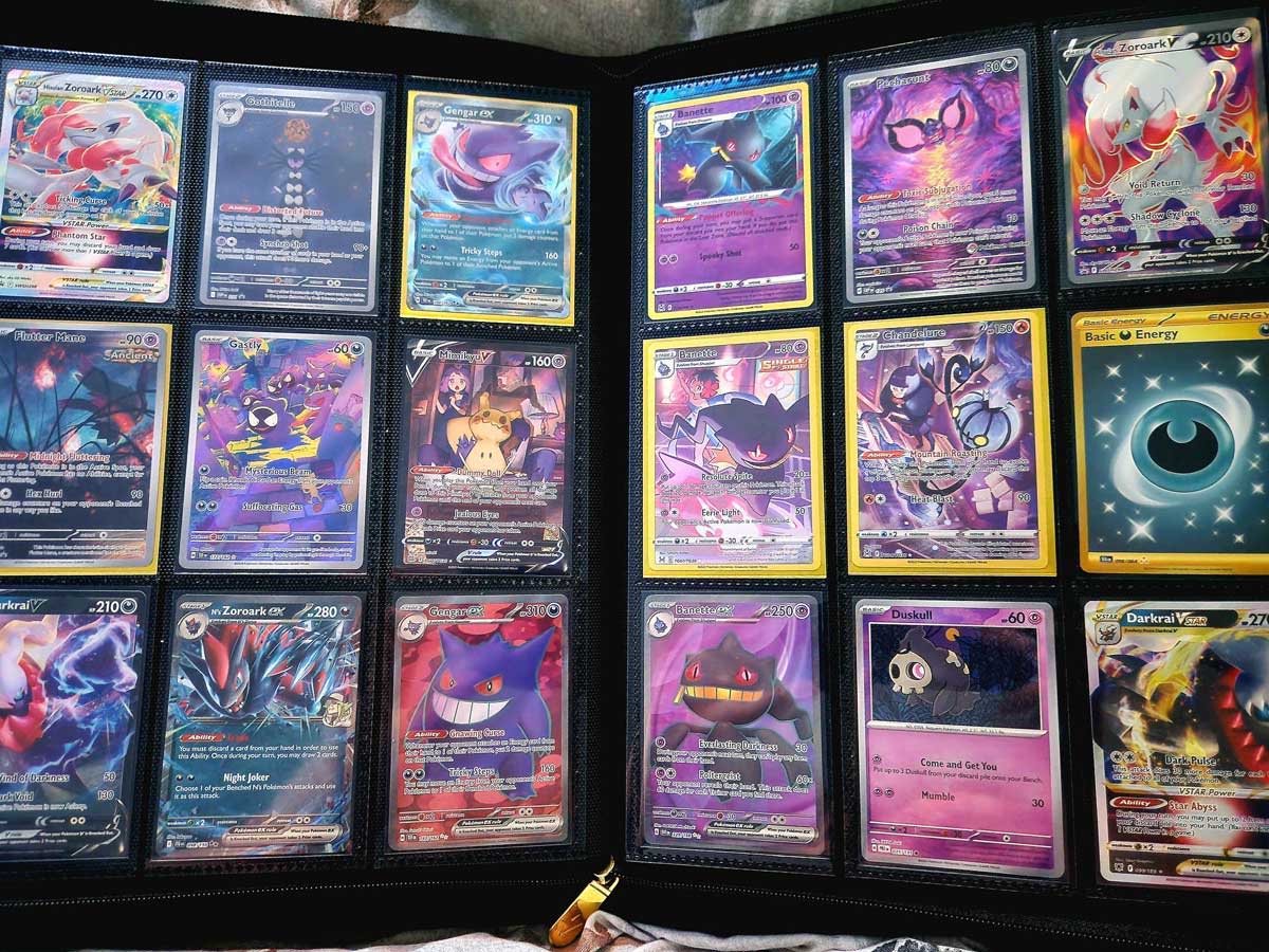 A collection of colorful trading cards displayed in a binder.