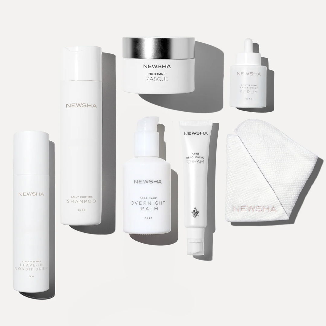 Assorted skincare products arranged on a light background.