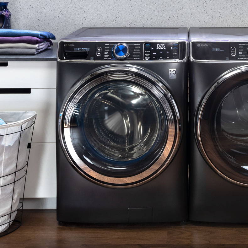 GE Profile Front Load washer and dryer in laundry room