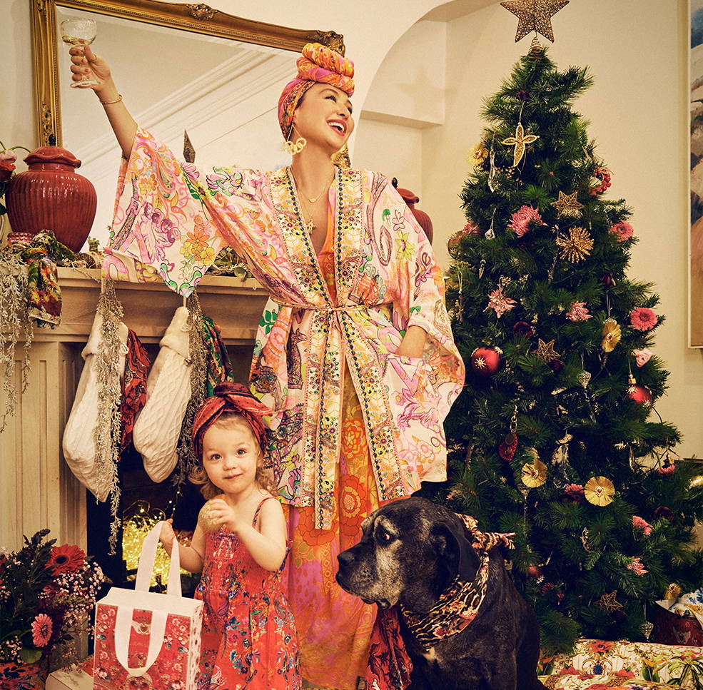 CAMILLA next to Christmas tree and Luna wearing 70's inspired prints