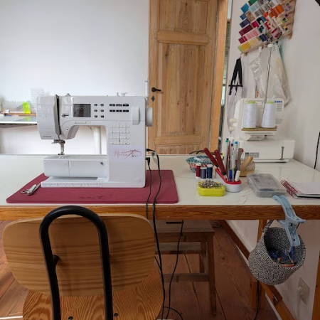 sewing machine table with tools and a machine