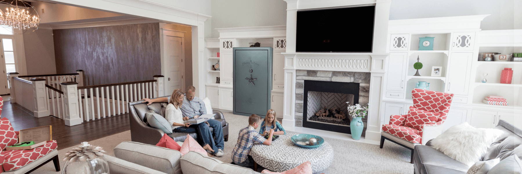 Family sitting in family room with safe in corner