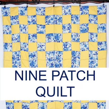 Nine Patch quilt with yellow and blue fabrics