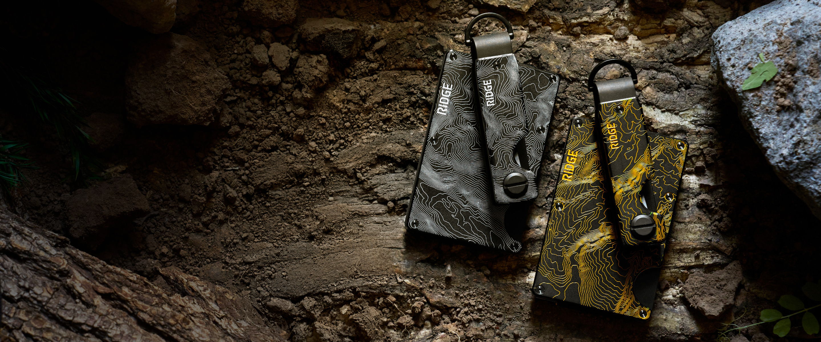 Two bags resting on the ground in a natural setting.