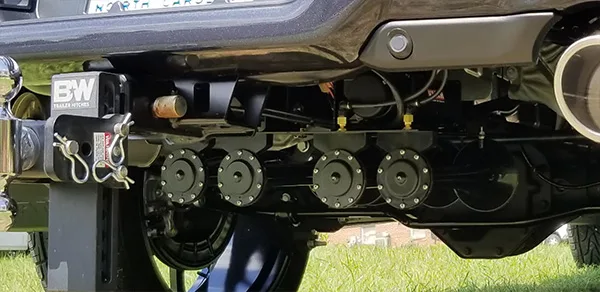 Five train horns and B&W trailer hitch mounted on the rear undercarriage of Ryan's Dodge Ram 1500