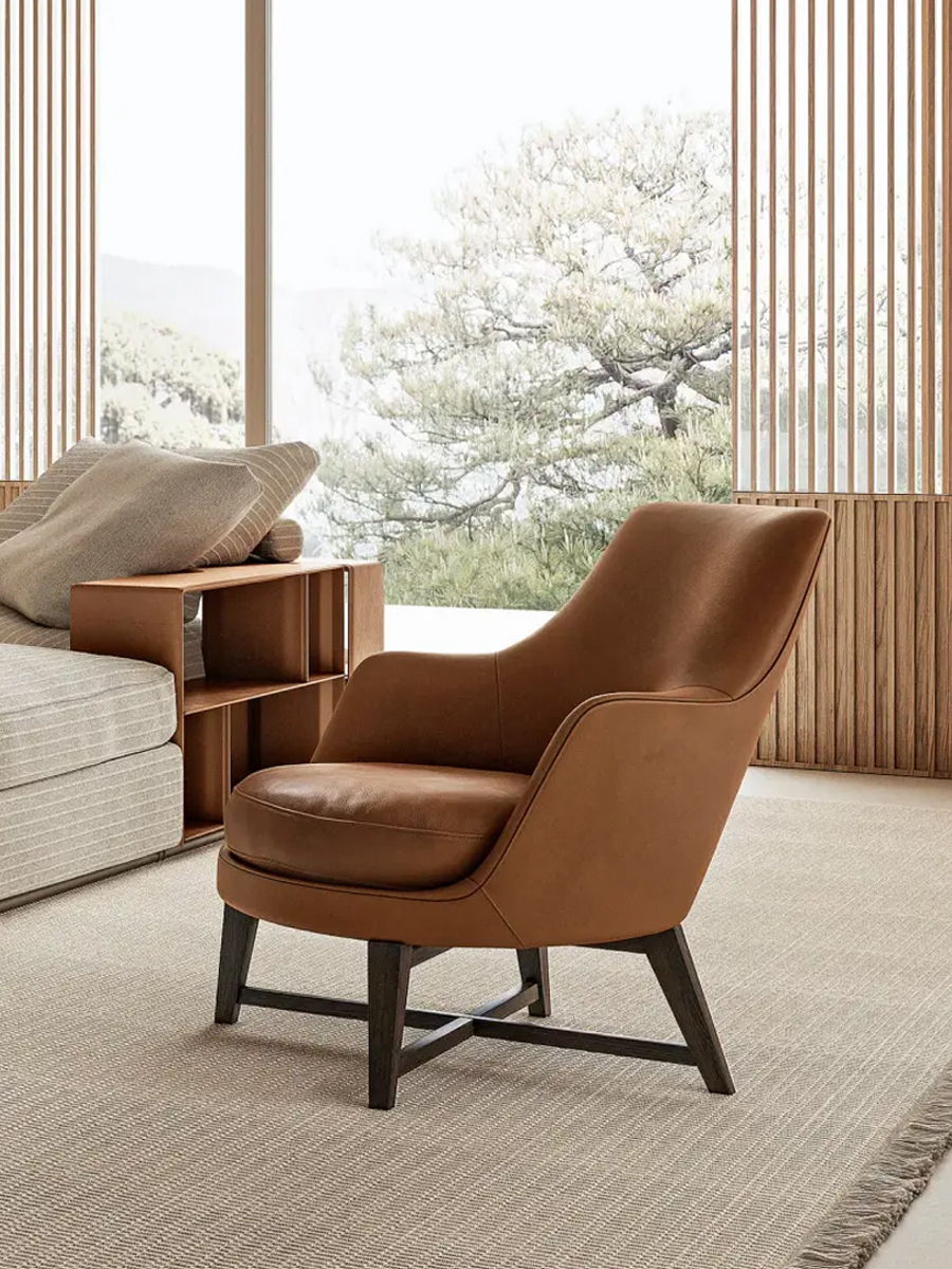 A stylish brown Flexform armchair in a cozy, modern interior setting.