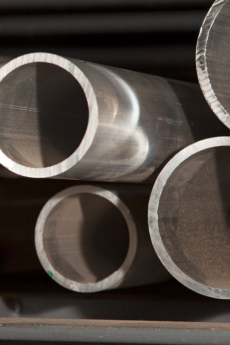 Close-up of a stack of pipes and round tubes