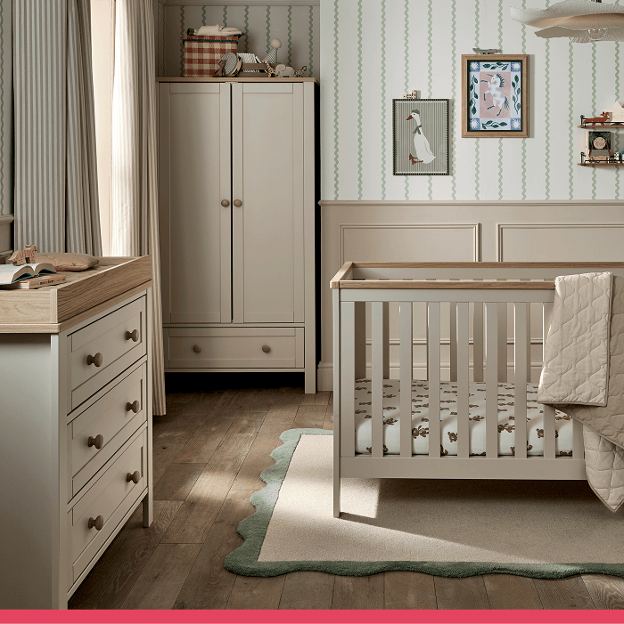 A cozy nursery featuring a crib, dresser, and decorative wall art.