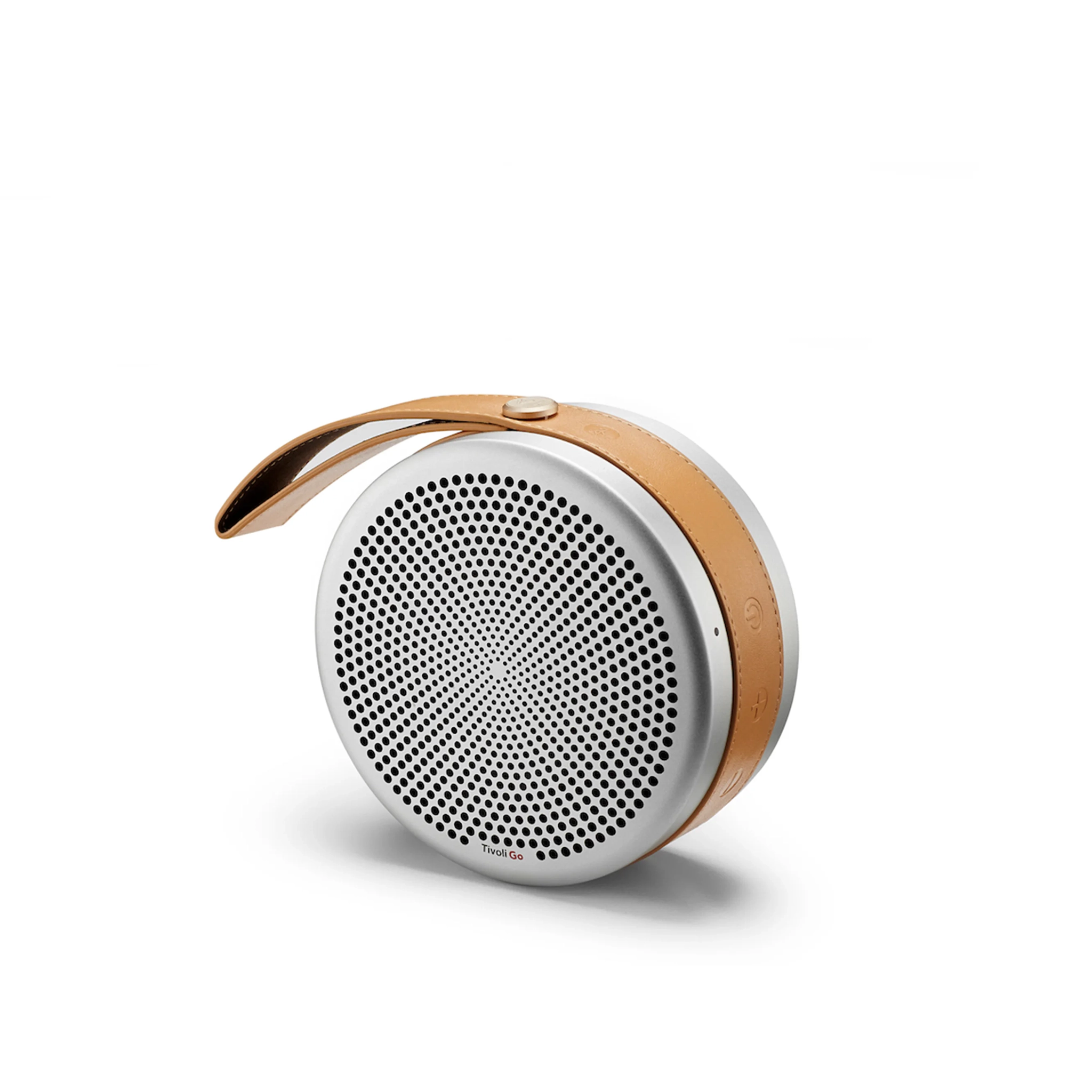 A round portable speaker with a leather strap.