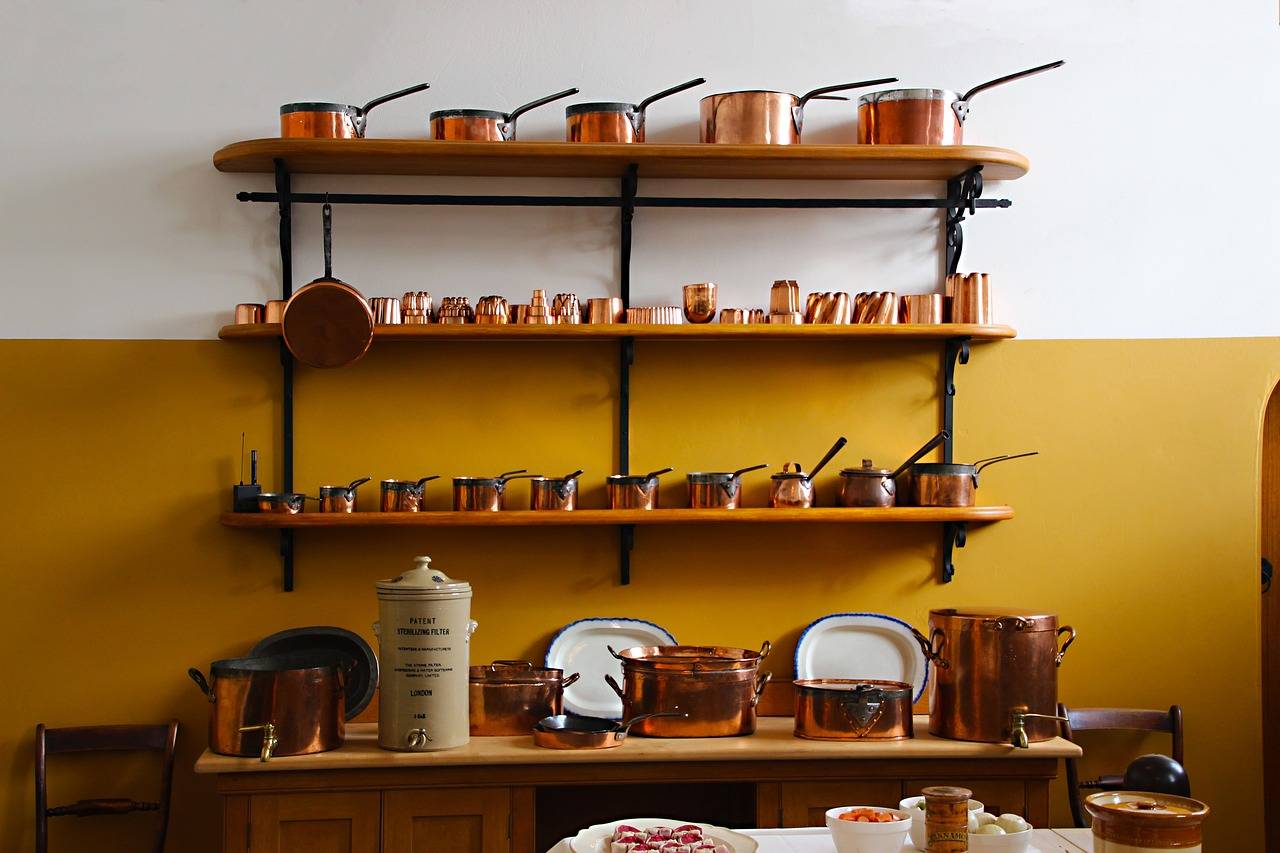 shelves of pots and pans made of the best cookware materials