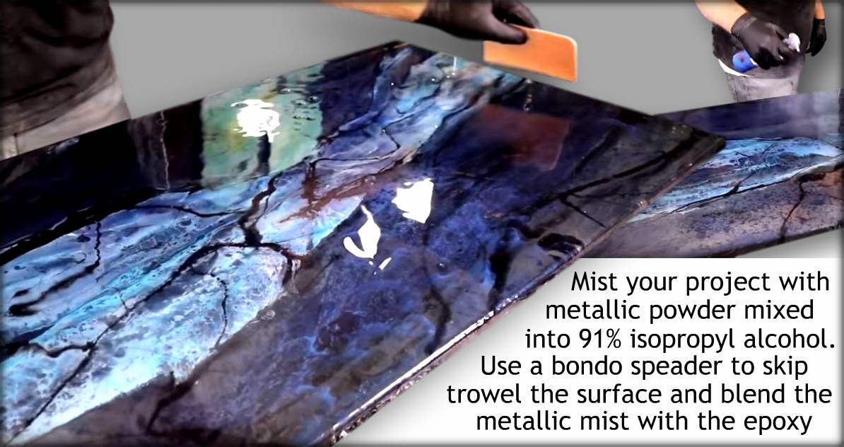 Use a Bondo spreader to skip trowel the surface, blending the metallic mist with the epoxy.