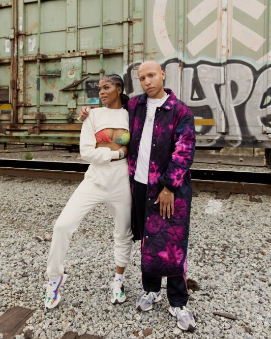 male and female model wearing shoe palace x new balance 327 unity pack by train tracks