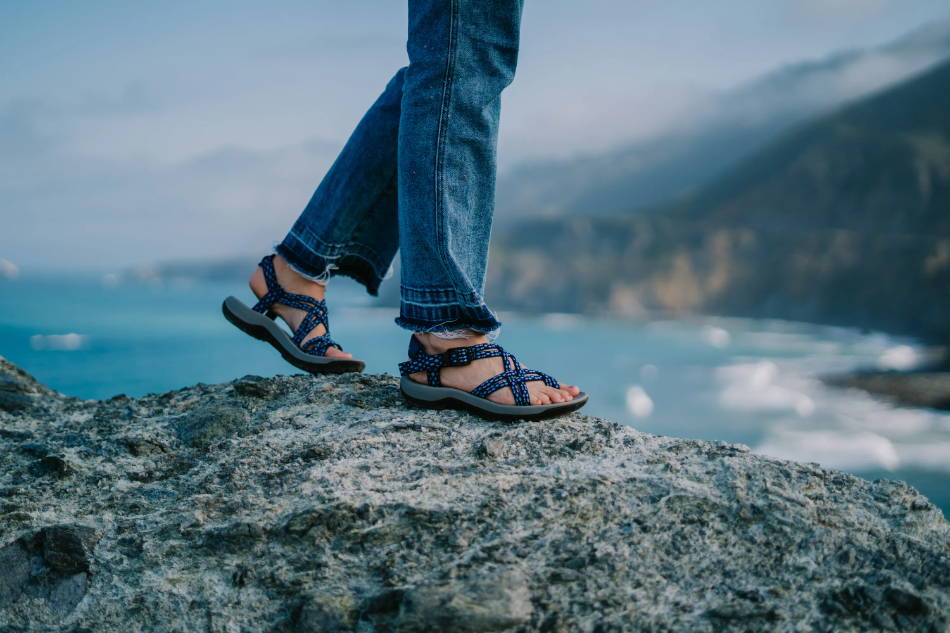 woman wearing sports sandals for river adventure