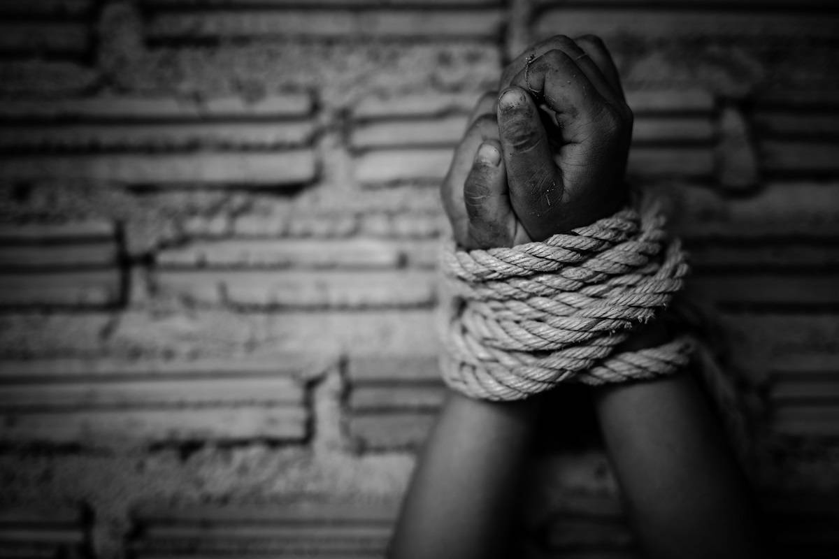 Hands bound by rope