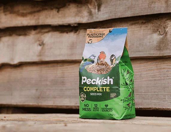 Peckish complete seed mix bag on floor