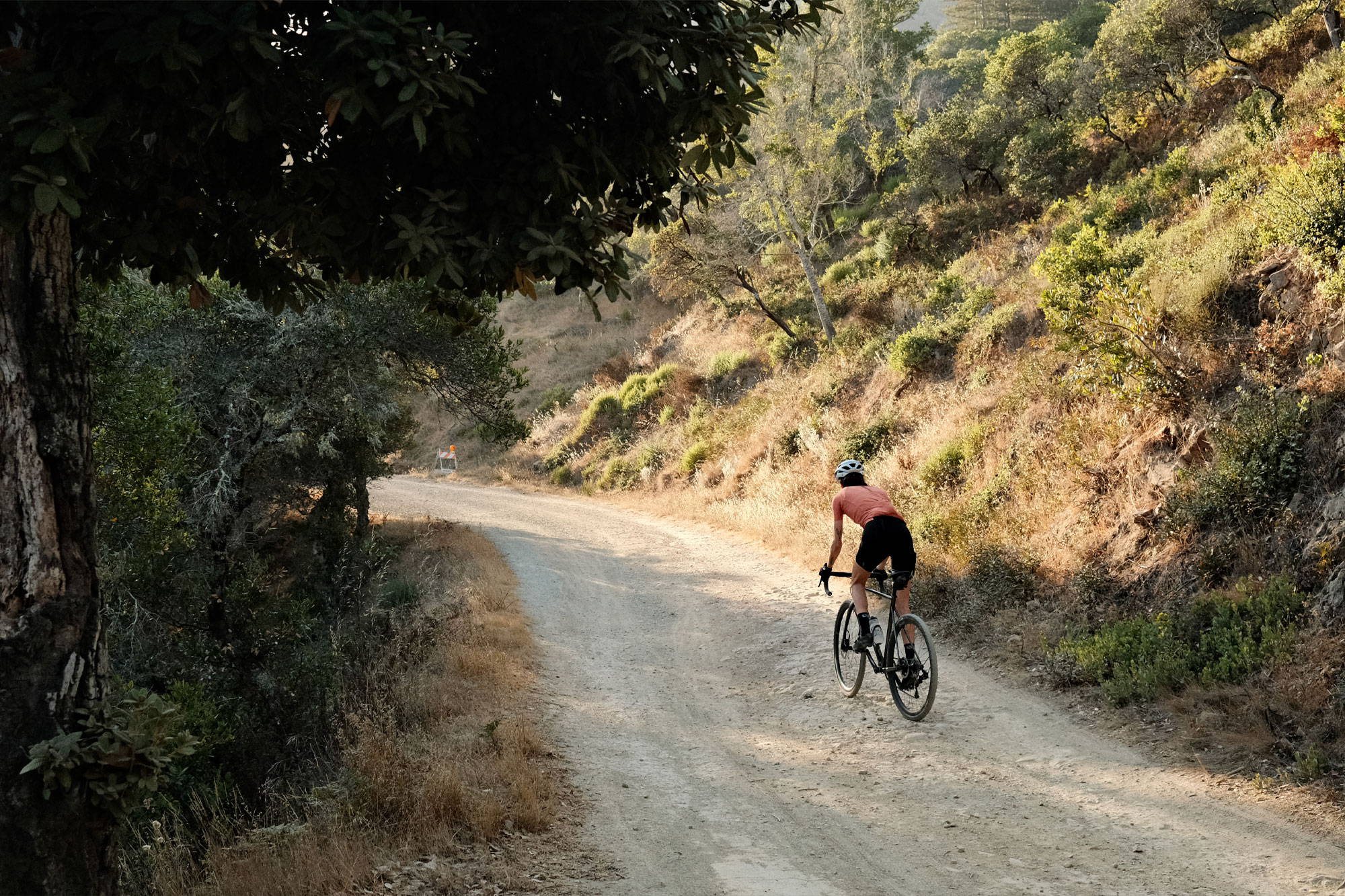 Rider heading up gravel climb